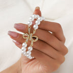 Apple Watch Bracelet with Pearl Beads, Central Knot Paved with Zirconia, Elastic, Vacra Model