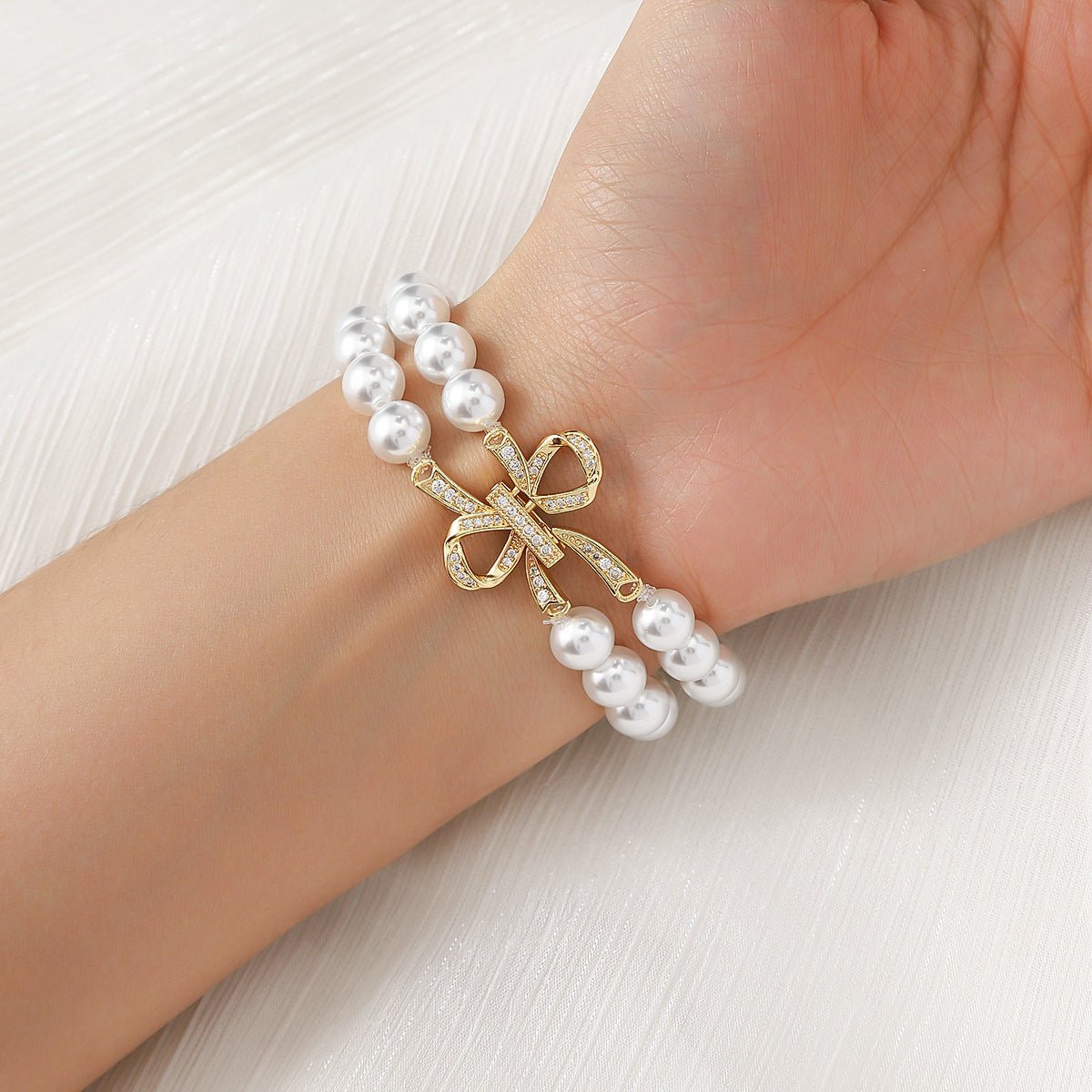 Apple Watch Bracelet with Pearl Beads, Central Knot Paved with Zirconia, Elastic, Vacra Model